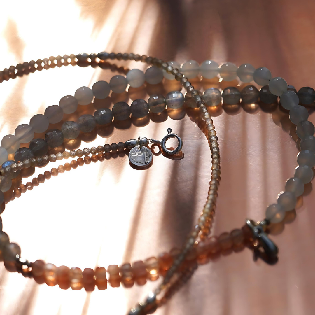 Close-up showing the beauty of the sunstones and moonstones that are part of the Ellie Necklace.