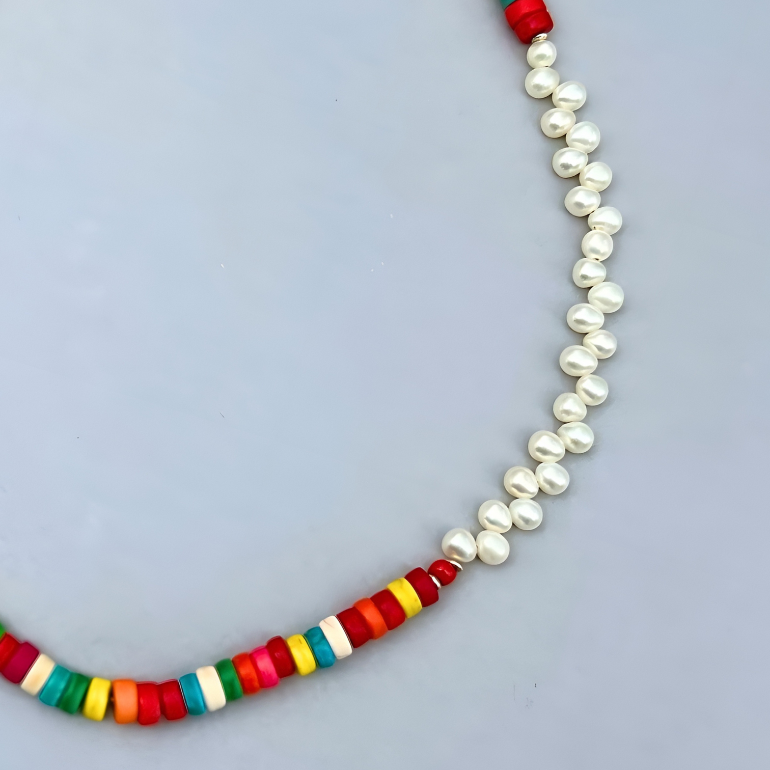 The trendy Le BijouBijou Rainbow Necklace made with Pearls and multicolored Howlite Discs. Detail shot